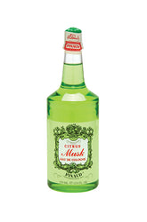 A clear 12.5-ounce bottle of Clubman Pinaud facing forward featuring its stylized label and sealed top cap